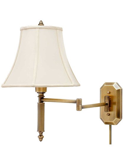 Cornelia Swing-Arm Wall Lamp in Antique Brass.